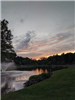 Dusk over a Park Fountain in a Pond