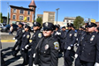 Officers March in the Street for the Memorial Day Parade