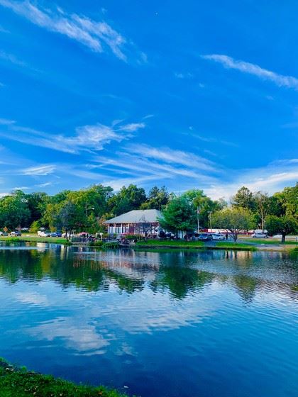 A Lake Clubhouse Seen Across Serene Waters