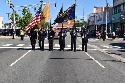 Honor Guard Marching in the Street with Flags