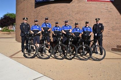 Bicycle Unit pose for a Group Photo with Bikes